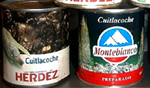 Figure 29. (a, left) Cans of cuitlacoche processed and sold in Mexico. (b, right) A growing market for cuitlacoche among English-speaking consumers is evident from recent label changes which include identification of the fungus as “maize mushrooms”. (Courtesy J.K. Pataky)