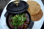 Figure 30. Cuitlacoche is served in soups, appetizers, and entrees at many fashionable Mexican restaurants in major metropolitan areas in the U.S., such as Rick Bayless’s Frontera Grill/Topolobampo in Chicago: (a, top) red chile braised mushrooms with cuitlacoche, roasted chayote and corn masa dumplings. (b, middle) pork tamales cooked in banana leaves with silky mulato chile cuitlacoche sauce, black beans and watercress salad. (c, right) green chile crepes filled with cuitlacoche, roasted vegetables and serrano chile over a green chile pepita sauce with squash blossom salad. (Courtesy Tracey Vowell, consulting chef, Frontera Grill.) 