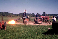 Figure 30. Flame killing of potato vines before harvest. (Courtesy H. D. Thurston)